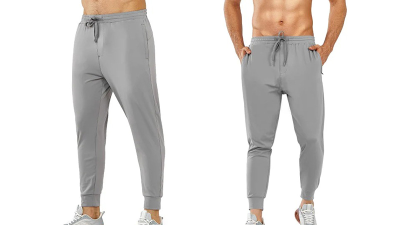 Men’s light gray jogger pants shown from front angles with drawstring waist and tapered cuffs.