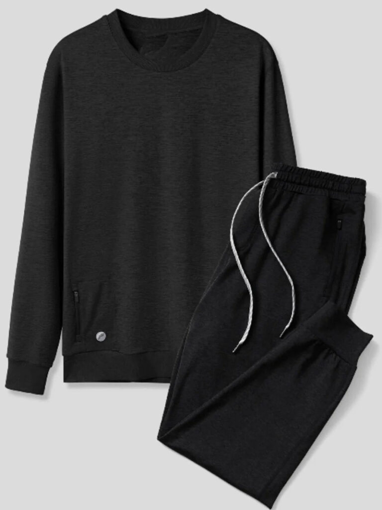 Black lounge set featuring crewneck sweatshirt and drawstring jogger pants on gray background.