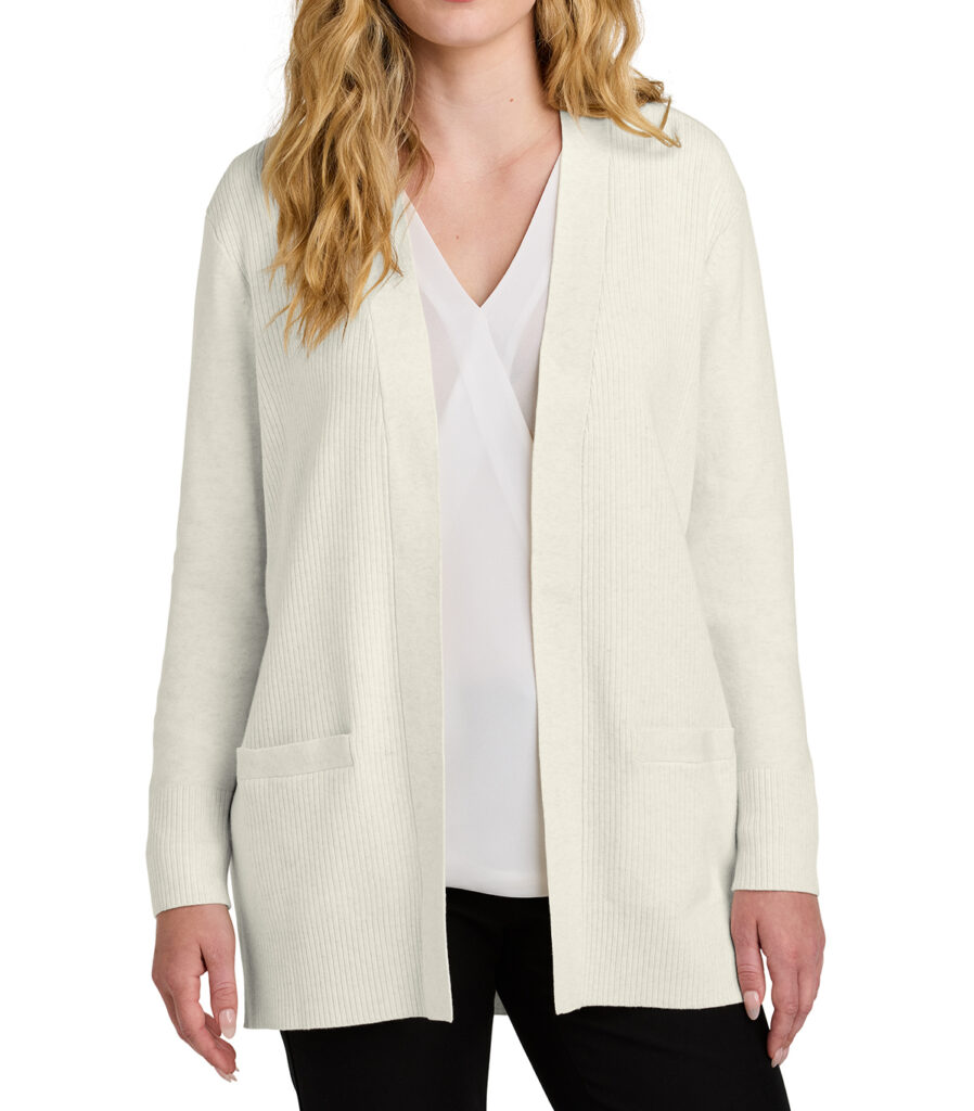 Woman wearing a long cream open-front cardigan layered over a white blouse and black pants.