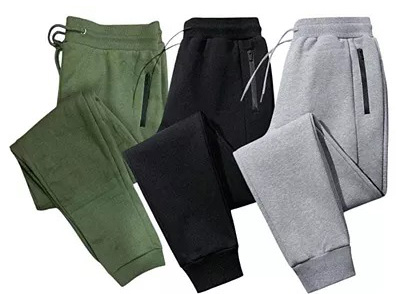 Three jogger pants in olive, black, and gray with zipper pockets.