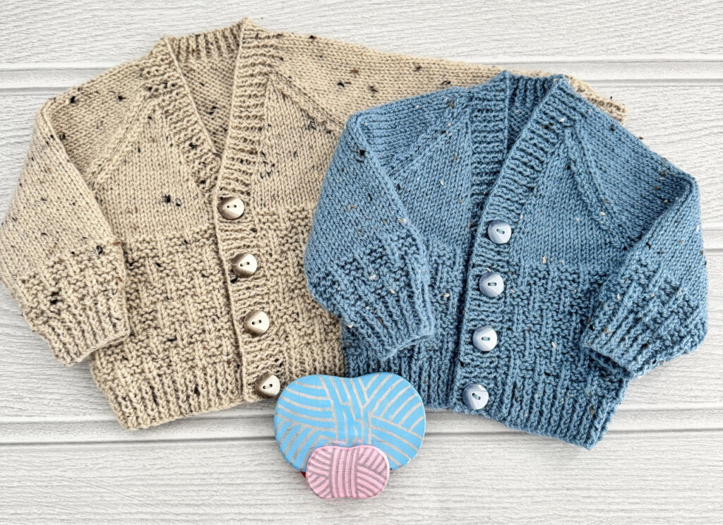 Two hand-knit cardigans in beige and blue with button fronts