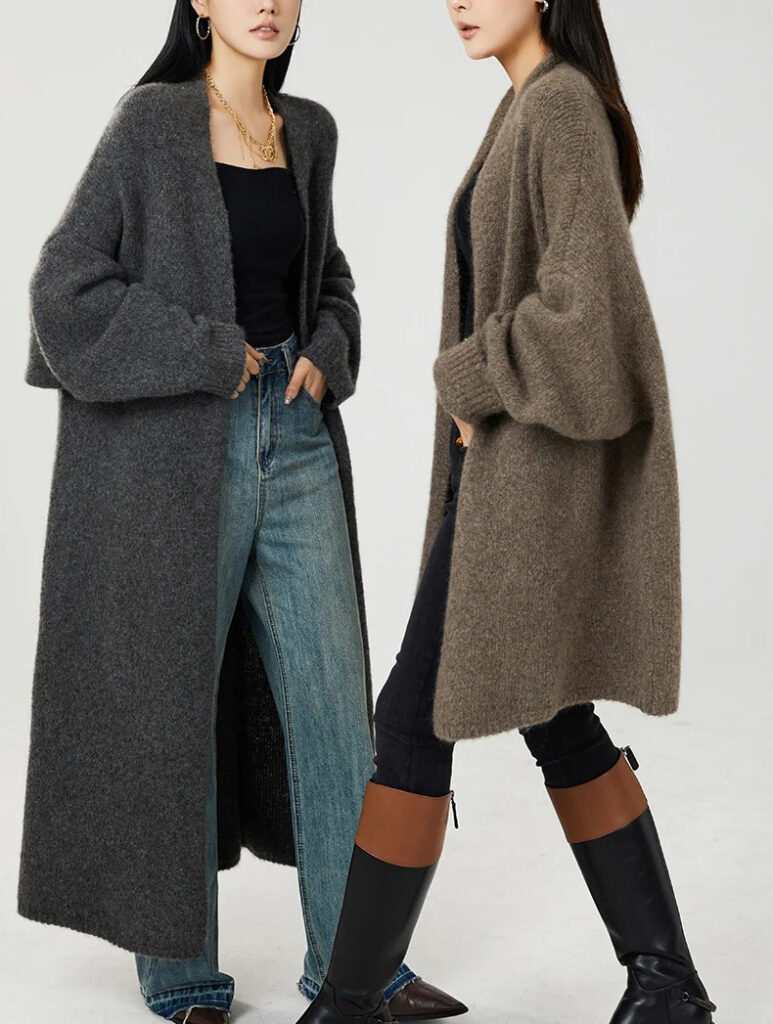 Two women modeling long fuzzy open-front cardigans in charcoal and taupe tones