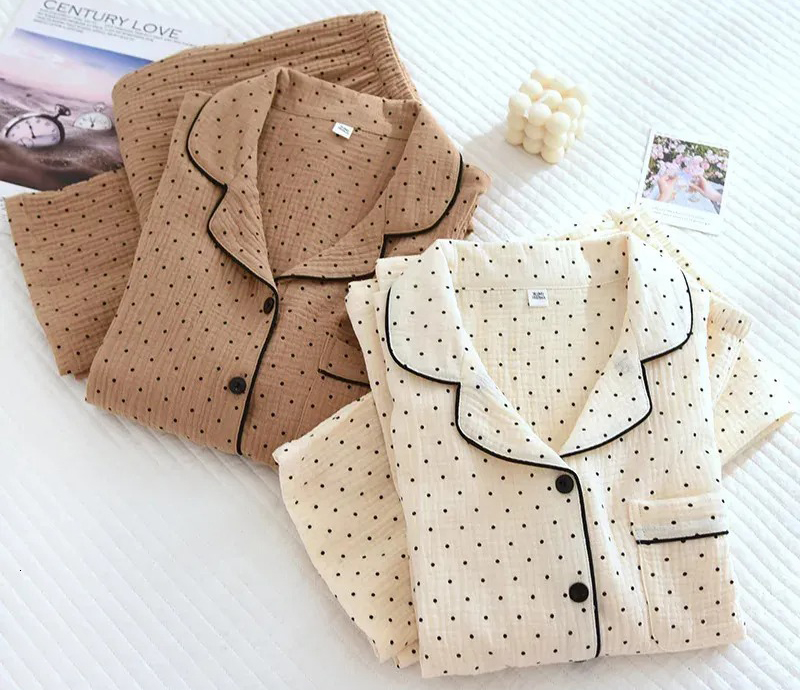Two folded polka dot pajama sets in beige and cream tones
