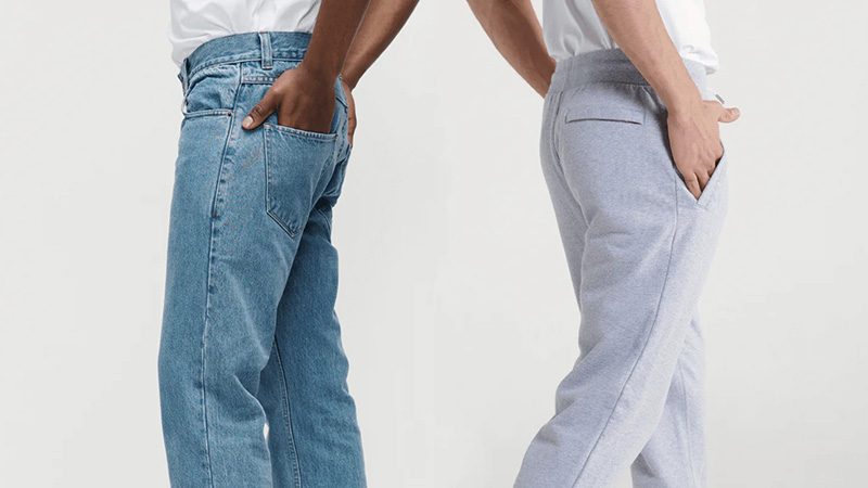 Side-by-side comparison of blue jeans and gray sweatpants from back view