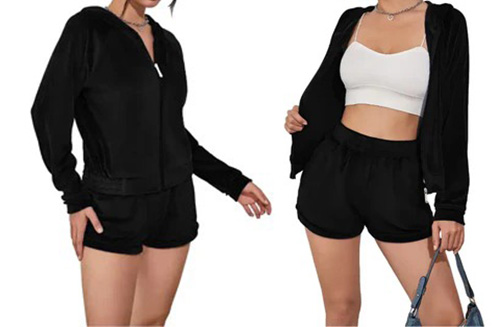 Two women modeling a black loungewear set consisting of a zip-up hoodie and matching shorts.