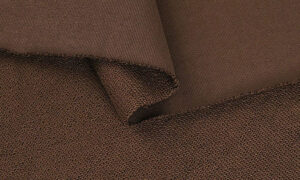 Close-up of brown French terry fabric showing looped inside texture