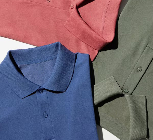 Three polo shirts laid flat in coral, blue, and sage green tones.