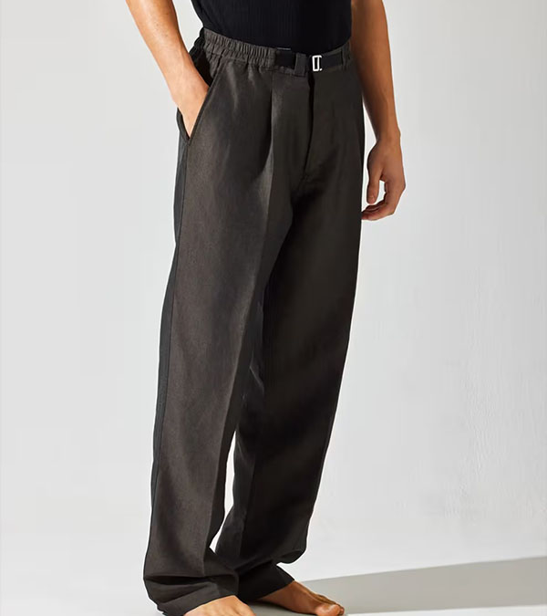 Men wearing dark gray wide-leg trousers with elastic waistband and front pleats.