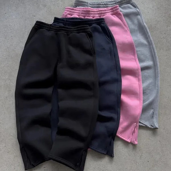 Fleece jogger sweatpants stacked in black, navy, pink, and gray color options.