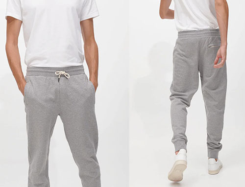 Man wearing gray jogger sweatpants shown from front and back views.