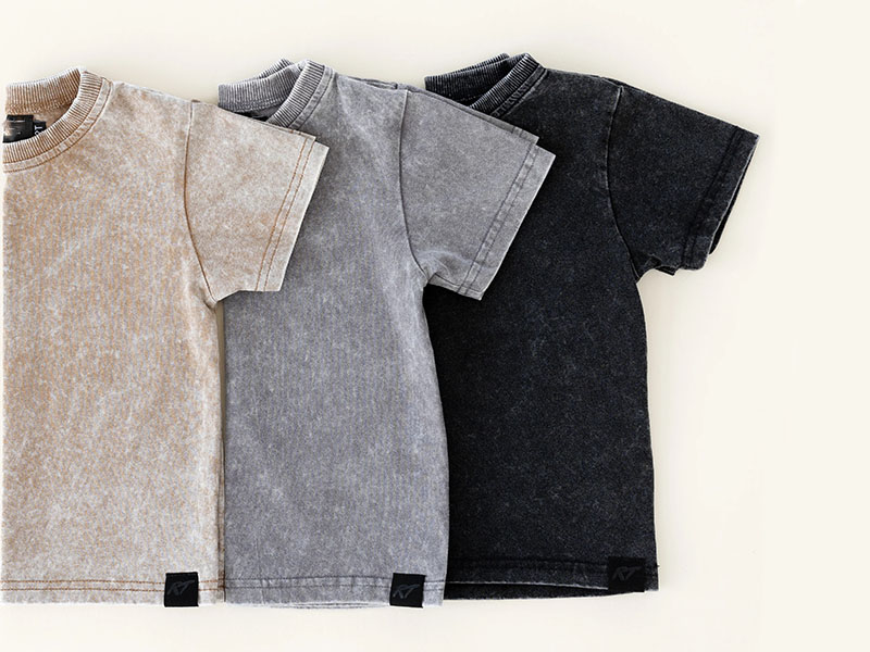 Three vintage washed cotton t-shirts in beige, gray, and black colors