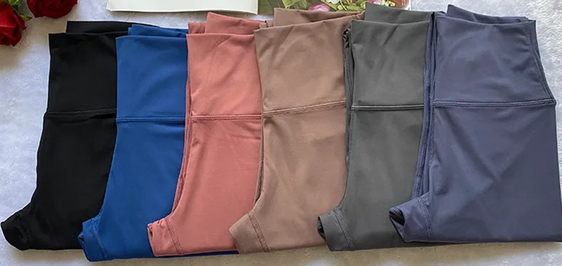 Folded high-waisted leggings in black, blue, pink, taupe, gray, and slate colors.