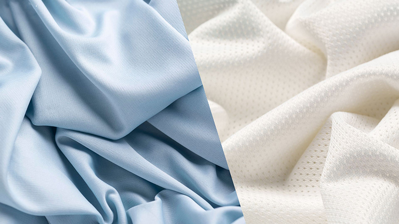 Two pieces of fabric placed side by side. The left fabric is smooth, light blue, and draped with soft folds. The right fabric is off-white with a subtle mesh texture, also gently folded.