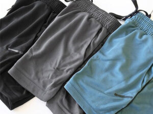 Black, gray, and blue athletic shorts with elastic waistbands and lightweight performance fabric for sports and training activities