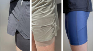 Athletic shorts with built-in compression liners, perforated fabric panels, and side phone pockets for running and training workouts