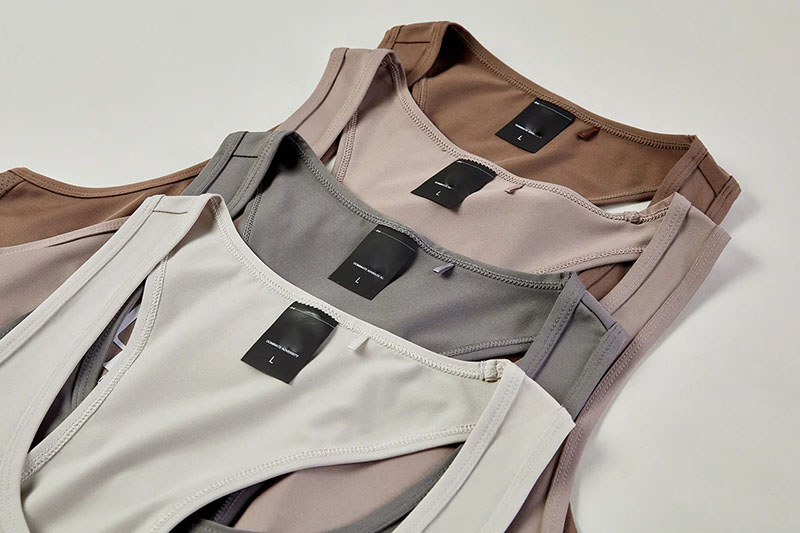 Neutral tank tops layered in beige, taupe, gray, blush, and cream tones.
