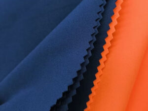 Blue and orange nylon spandex fabric swatches with smooth stretch texture for sportswear and swimwear applications