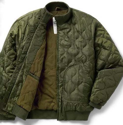 Green quilted jacket with zipper, elastic cuffs, and brown inner lining laid flat.