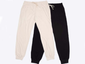 Beige and black organic cotton jogger pants with elastic cuffs and drawstrings