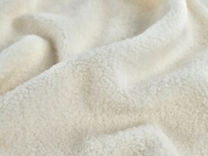 Cream fleece fabric with plush texture for warm and comfortable winter clothing