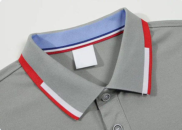 Close-up of gray polo shirt collar with red, white, and blue trim detail.