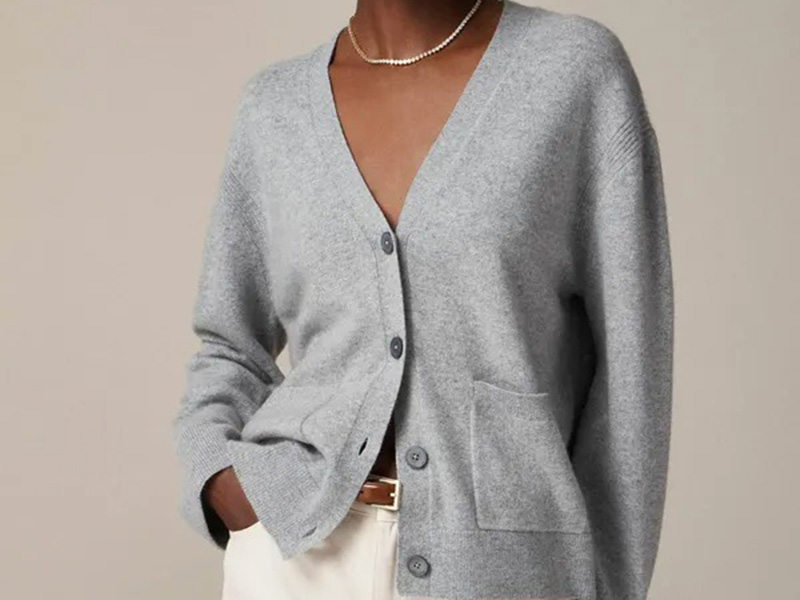 Women's soft gray knit cardigan with button front and relaxed fit design