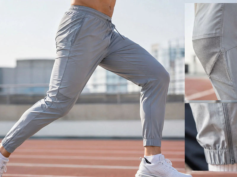 Lightweight gray running pants with mesh airflow panels for active workouts
