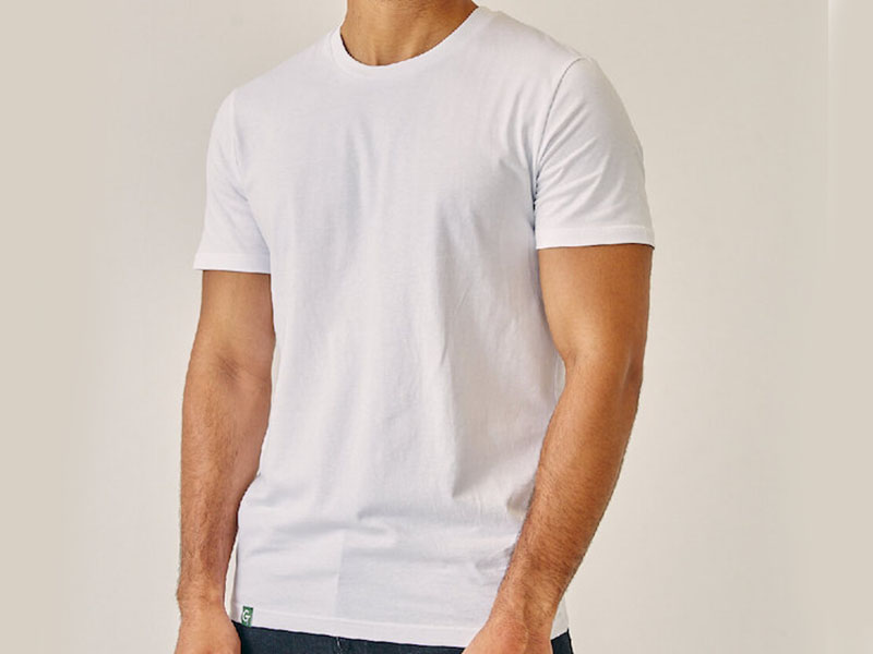 Man wearing blank white cotton t-shirt isolated on neutral background