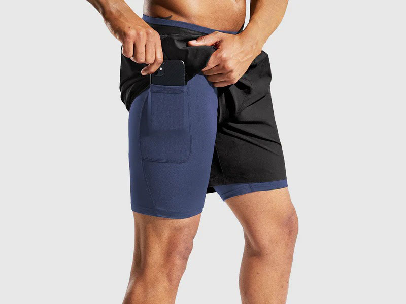 Men's athletic compression shorts with phone pocket and layered running design
