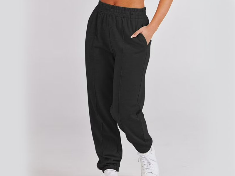 Black tapered jogger sweatpants with elastic waistband and casual athletic fit design