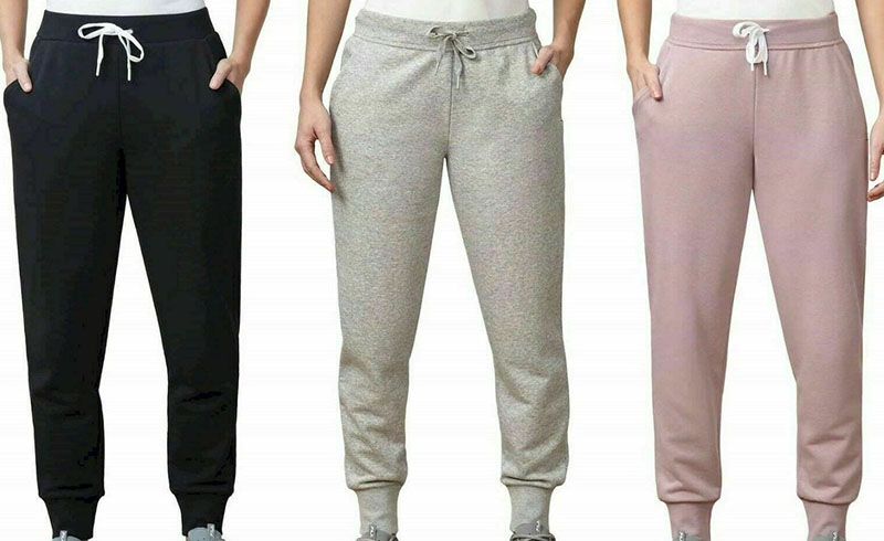 Women’s jogger sweatpants in black, gray, and blush pink with drawstring waists.