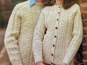 Classic cream cable knit sweaters featuring textured patterns, button details, and timeless handcrafted winter fashion style.