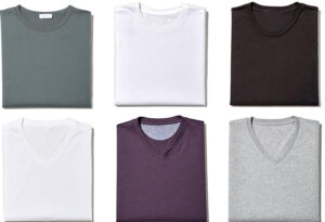 Crew neck and V-neck T-shirts folded neatly in multiple colors.