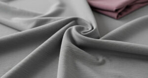 Close-up of soft gray cotton-elastane fabric suitable for stretch garments.