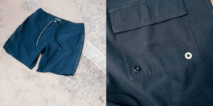 Navy board shorts with drawstring waist and rear pocket detail, showcasing lightweight quick-dry fabric for surfing, swimming, and beach activities.