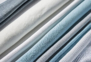 Assorted performance fabric samples featuring mesh, knit, and breathable textile structures for activewear, sportswear, and moisture-wicking apparel applications.