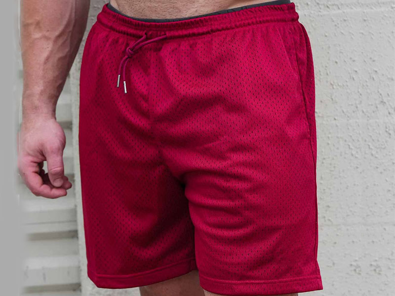 Men's maroon breathable mesh athletic shorts with elastic waistband and drawstring.